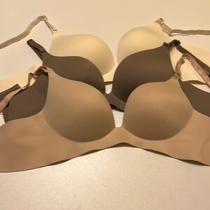 Comfort flex bras. Size large. White, brown, and nude brand new never worn.